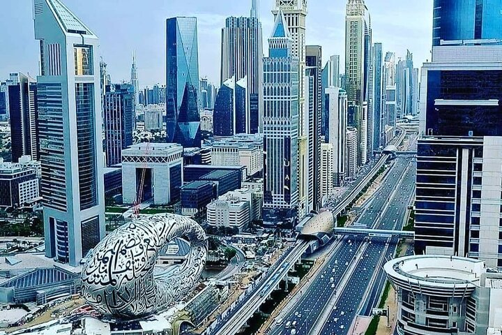 Explore Dubai's iconic skyline featuring architectural marvels and bustling streets. Discover rich cultural heritage and modern luxury on an unforgettable half-day city tour with expert insights.